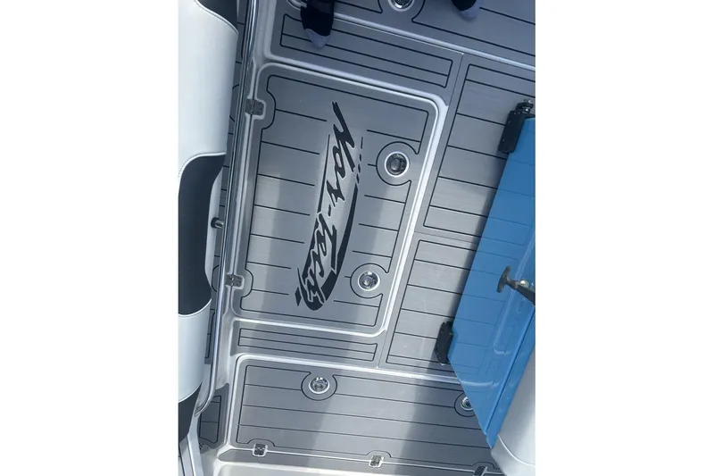 Slide: The Image of 2025 Nor-Tech 340 Sport Center Console deck with logo and sleek design. - 19