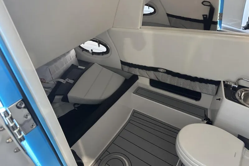 Slide: The Image of Interior of 2025 Nor-Tech 340 Sport Center Console with seating and toilet. - 23