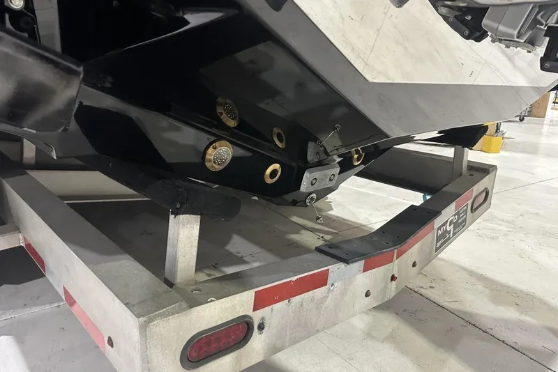 Slide: The Image of 2025 Nor-Tech 340 Sport Center Console on trailer, showcasing hull and fittings. - 24