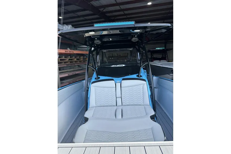 Slide: The Image of 2025 Nor-Tech 340 Sport Center Console boat interior with modern seating and sleek design. - 33