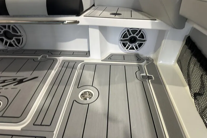 Slide: The Image of 2025 Nor-Tech 340 Sport Center Console interior with sleek flooring and built-in speakers. - 9