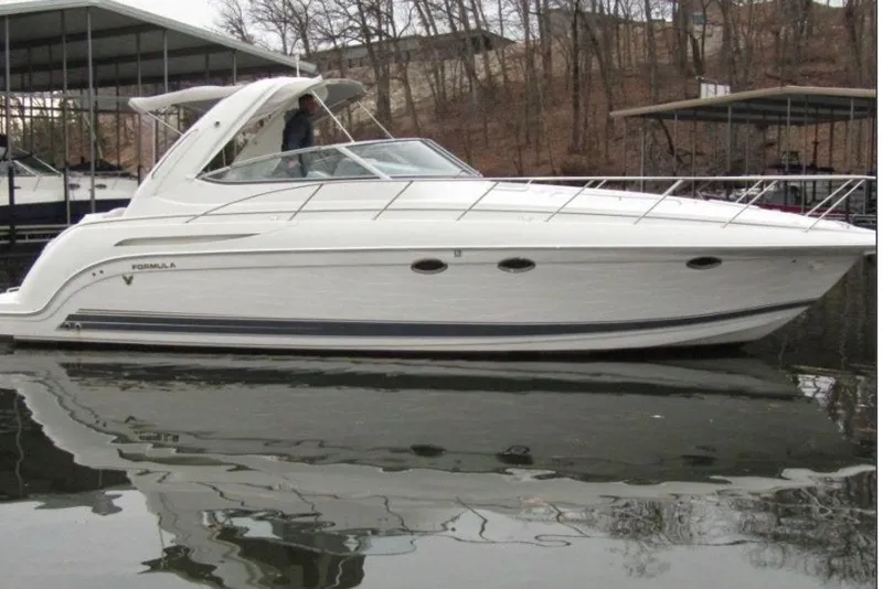 The Image of 2002 Formula 37 Performance Cruiser docked on calm water. - 0