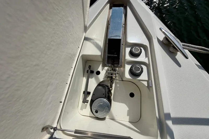 Slide: The Image of Anchor locker of a 2002 Formula 37 Performance Cruiser, featuring chain and controls. - 10
