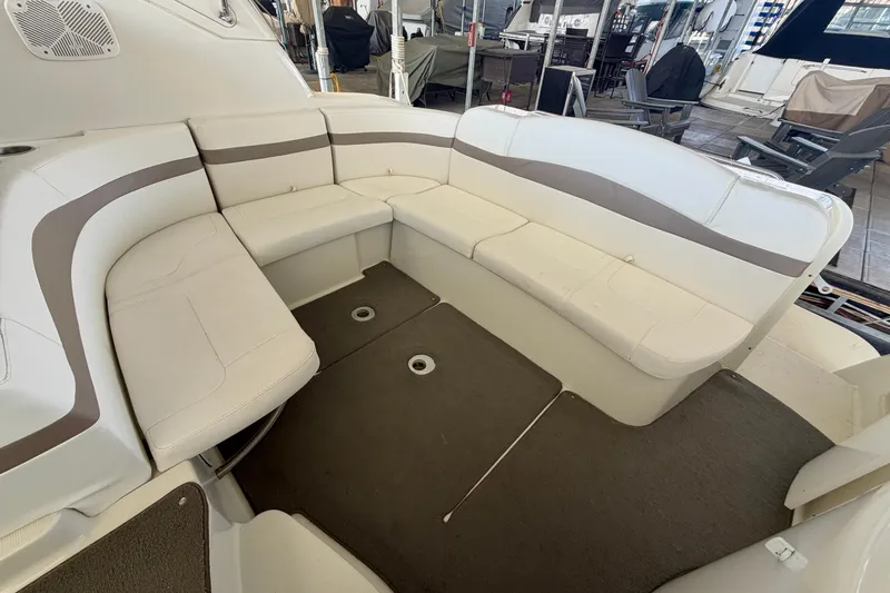 Slide: The Image of 2002 Formula 37 Performance Cruiser interior seating area with white and gray upholstery. - 11
