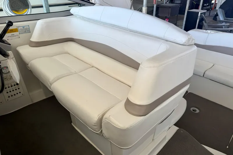 Slide: The Image of White leather seating on a 2002 Formula 37 Performance Cruiser boat. - 17