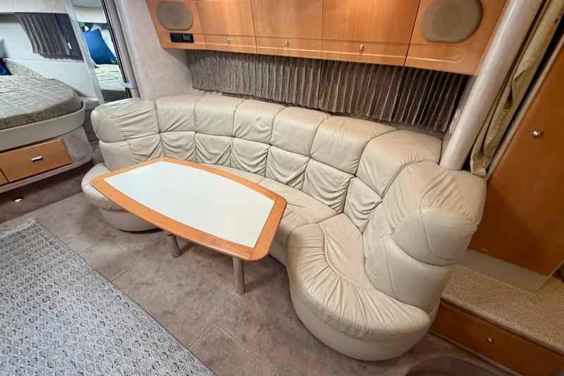 Slide: The Image of Luxurious interior of 2002 Formula 37 Performance Cruiser with plush seating and elegant table. - 25
