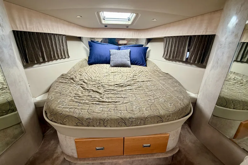 Slide: The Image of Luxurious cabin interior of 2002 Formula 37 Performance Cruiser with cozy bed and elegant decor. - 28