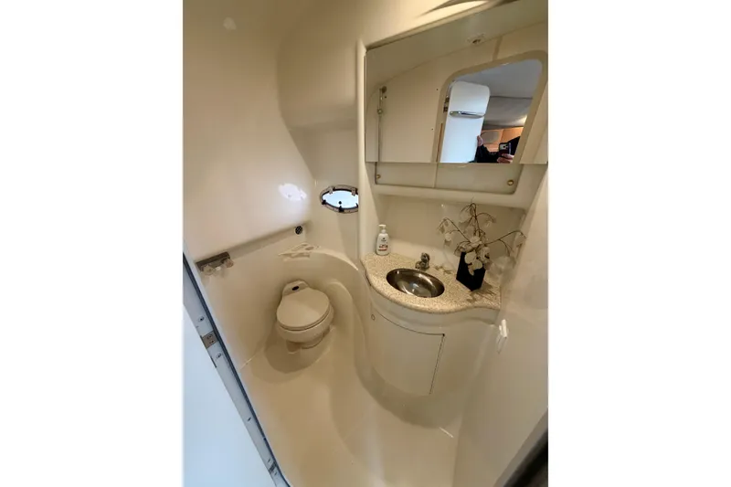 Slide: The Image of 2002 Formula 37 Performance Cruiser bathroom with sink, toilet, and mirror. - 34