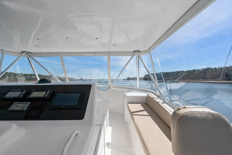 Slide: The Image of Interior view of 2002 Viking 61 Convertible yacht with navigation equipment and scenic waterway. - 12