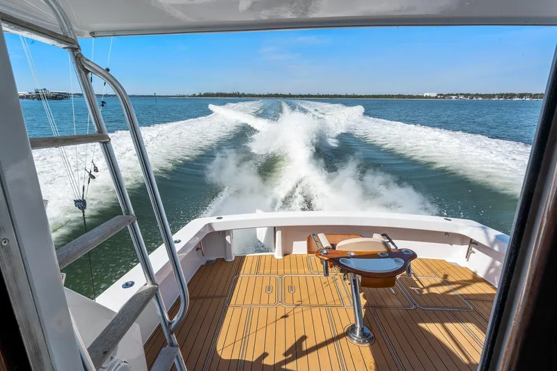 Slide: The Image of Viking 61 Convertible 2002 yacht cruising, view from deck with wake trails. - 17