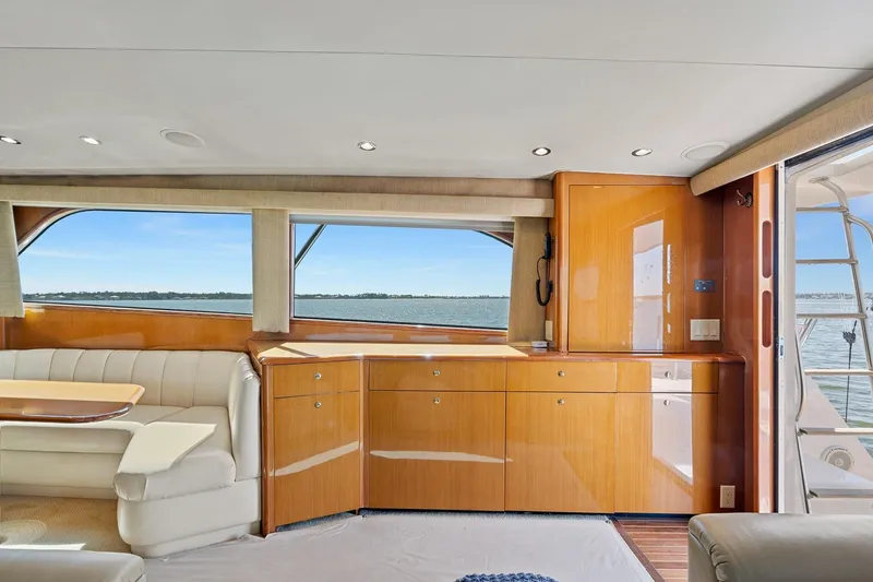 Slide: The Image of Luxurious interior of 2002 Viking 61 Convertible yacht with ocean view. - 22