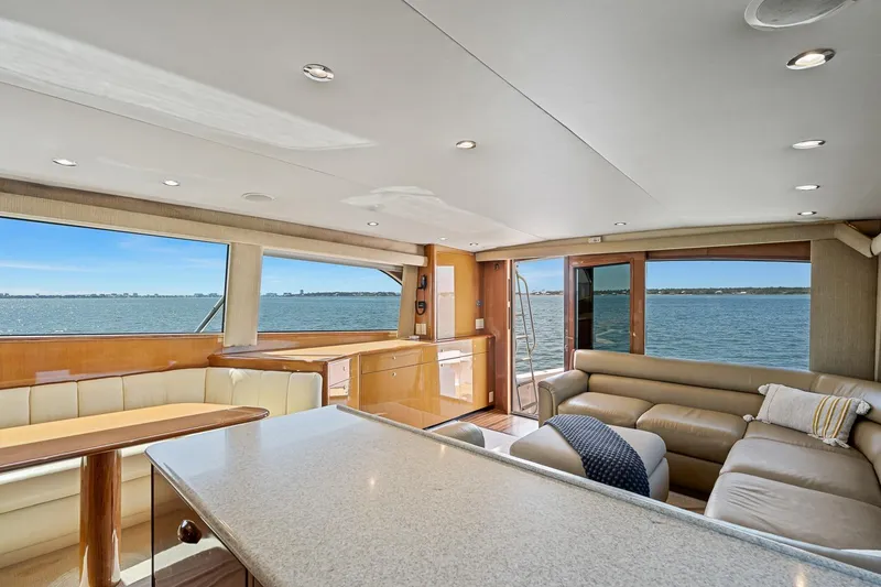 Slide: The Image of Luxurious interior of 2002 Viking 61 Convertible yacht with ocean view. - 25
