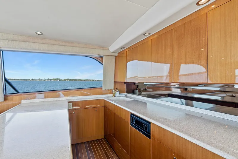 Slide: The Image of Luxurious kitchen interior of 2002 Viking 61 Convertible yacht with ocean view. - 26