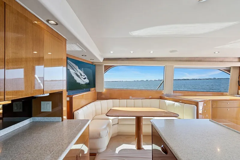 Slide: The Image of Luxurious interior of 2002 Viking 61 Convertible yacht with ocean view. - 28