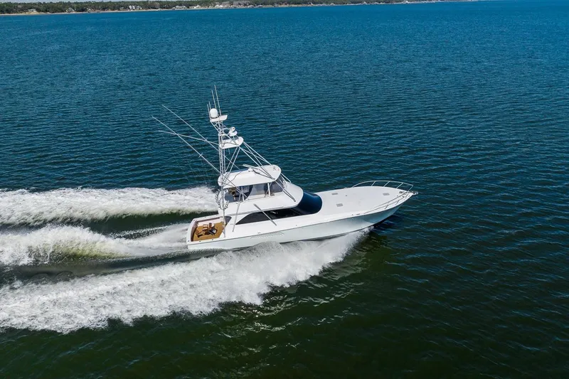 Slide: The Image of 2002 Viking 61 Convertible yacht cruising on open water. - 3