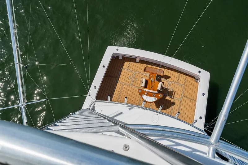 Slide: The Image of Aerial view of 2002 Viking 61 Convertible yacht deck over green water. - 41