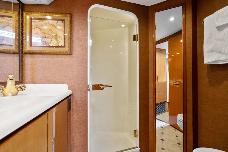 Slide: The Image of Luxurious bathroom interior of 2002 Viking 61 Convertible yacht with shower and elegant decor. - 54