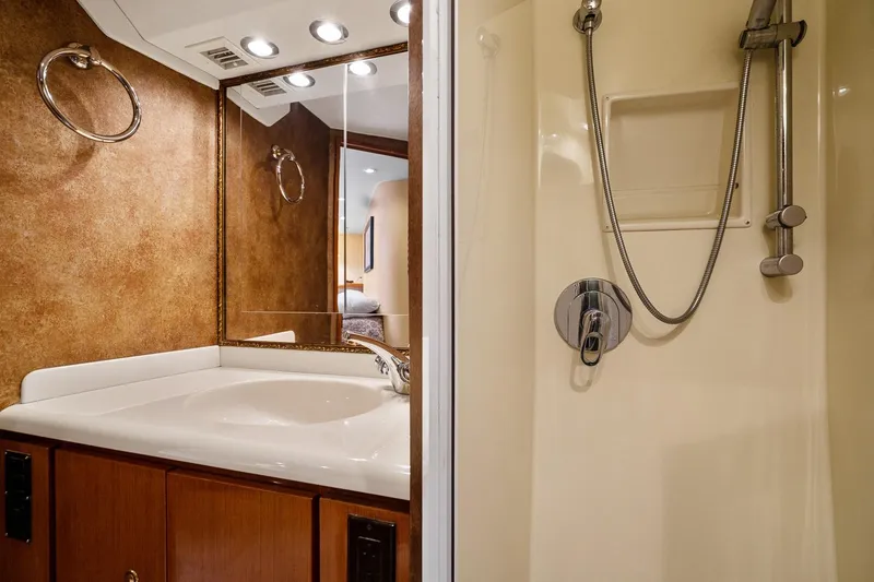 Slide: The Image of Luxurious bathroom in 2002 Viking 61 Convertible yacht with shower and vanity. - 57