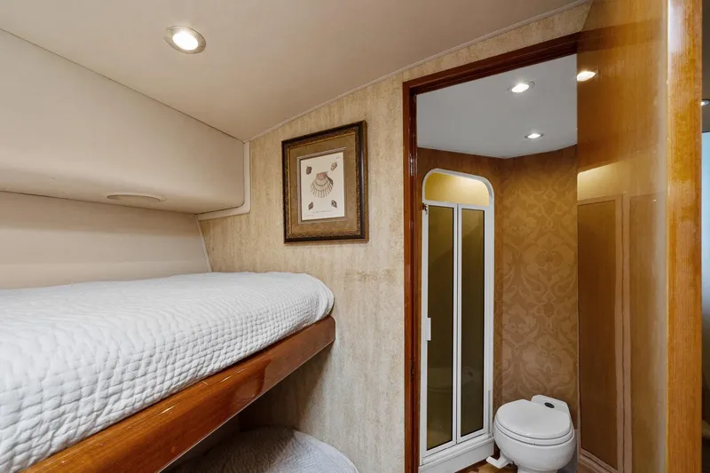 Slide: The Image of Interior of 2002 Viking 61 Convertible yacht with bunk beds and bathroom. - 58