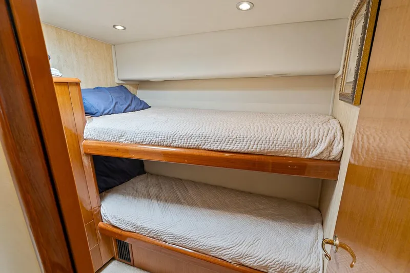 Slide: The Image of Interior of 2002 Viking 61 Convertible yacht with cozy bunk beds. - 59