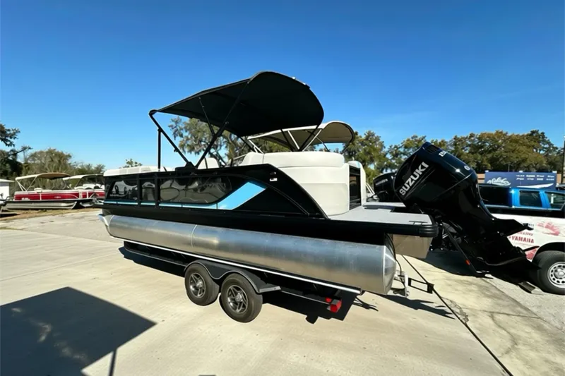 The Image of 2026 Sweetwater 2286 QS pontoon boat on trailer, featuring sleek design and modern amenities. - 0
