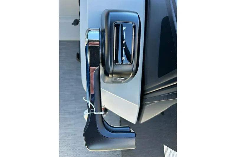 Slide: The Image of Throttle control lever on 2026 Sweetwater 2286 QS boat, showing forward and reverse settings. - 12