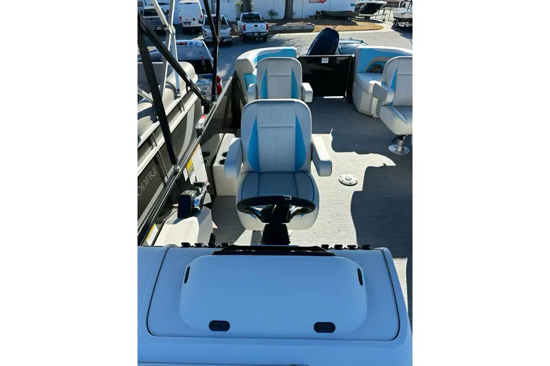 Slide: The Image of 2026 Sweetwater 2286 QS boat interior with modern seating and steering wheel. - 14