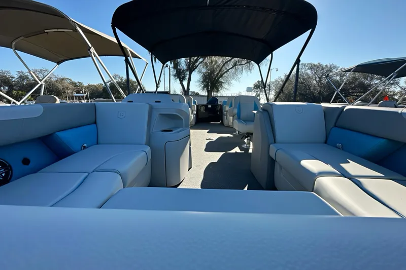 Slide: The Image of 2026 Sweetwater 2286 QS pontoon boat interior with spacious seating and canopy. - 2