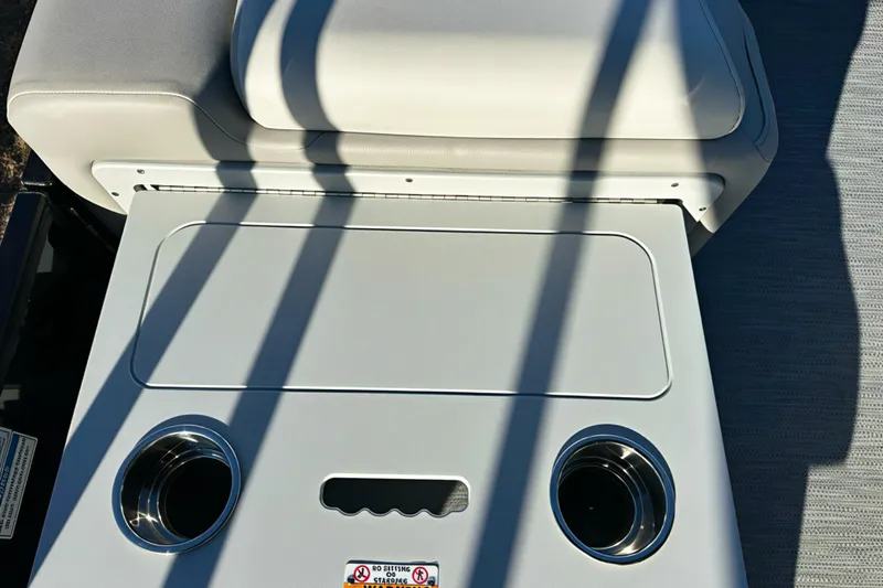 Slide: The Image of 2026 Sweetwater 2286 QS boat seat with integrated cup holders and storage. - 23