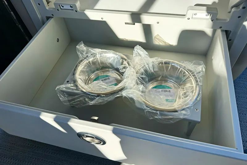 Slide: The Image of Open drawer with two packaged metal bowls, Sweetwater 2286 QS, 2026 model. - 24