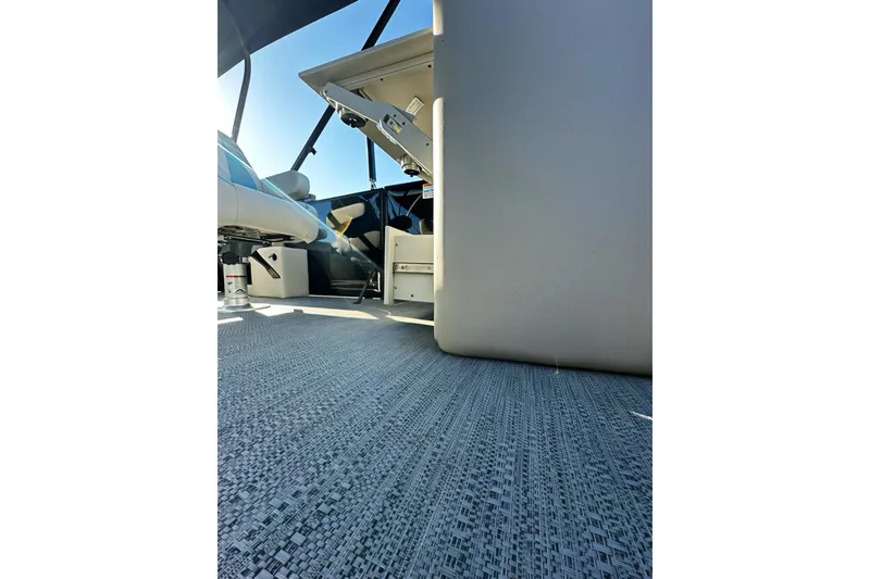 Slide: The Image of Interior view of 2026 Sweetwater 2286 QS boat, showcasing seating and flooring. - 26