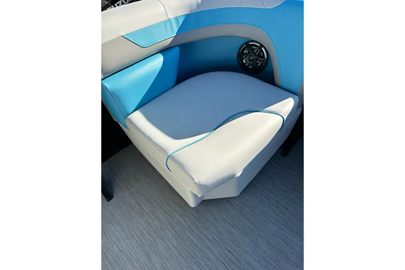 Slide: The Image of 2026 Sweetwater 2286 QS boat seat with blue and white upholstery, featuring a speaker. - 31