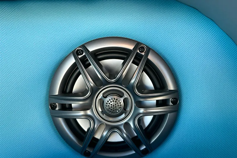 Slide: The Image of Silver speaker on textured blue surface, Sweetwater 2286 QS, 2026 model. - 32