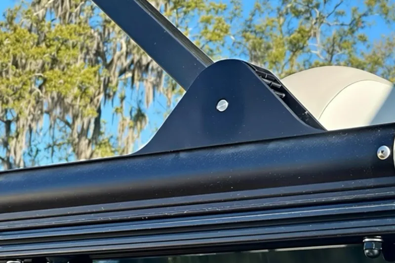 Slide: The Image of Close-up of 2026 Sweetwater 2286 QS boat detail against a clear blue sky. - 33