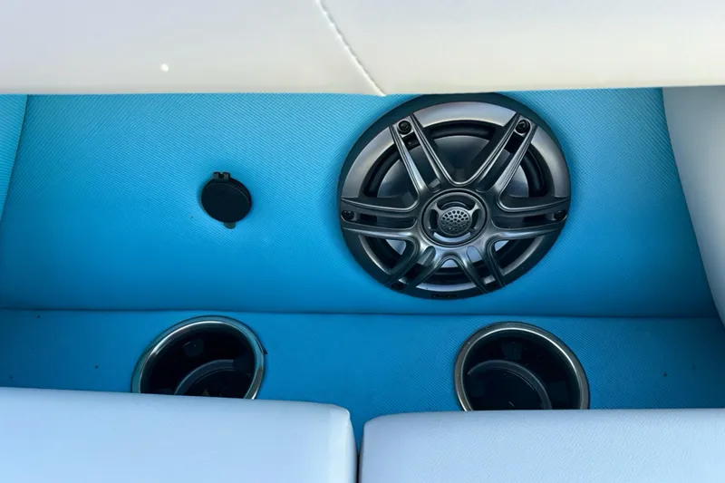 Slide: The Image of Speaker and cup holders on Sweetwater 2286 QS boat, 2026 model, with blue interior. - 5