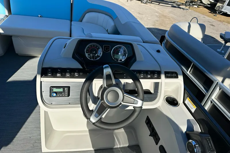 Slide: The Image of 2026 Sweetwater 2286 QS boat dashboard with steering wheel and control panel. - 8