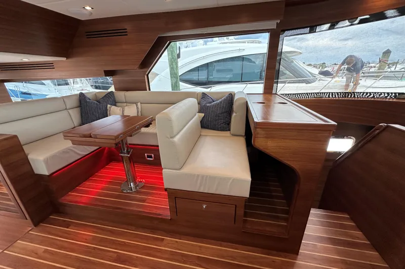 Slide: The Image of Luxurious interior of 2026 Summit 54 yacht with elegant seating and wooden finishes. - 10