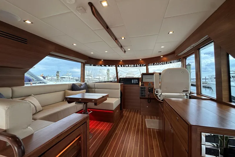 Slide: The Image of Luxurious interior of 2026 Summit 54 yacht with elegant wood finish and modern seating. - 11