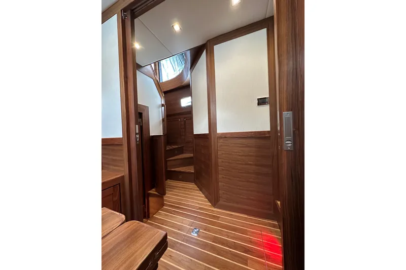 Slide: The Image of Luxurious interior of 2026 Summit 54 yacht with elegant wood paneling and modern lighting. - 15