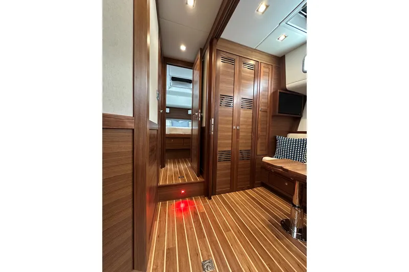 Slide: The Image of Luxurious interior of 2026 Summit 54 yacht with wooden finishes and modern amenities. - 16