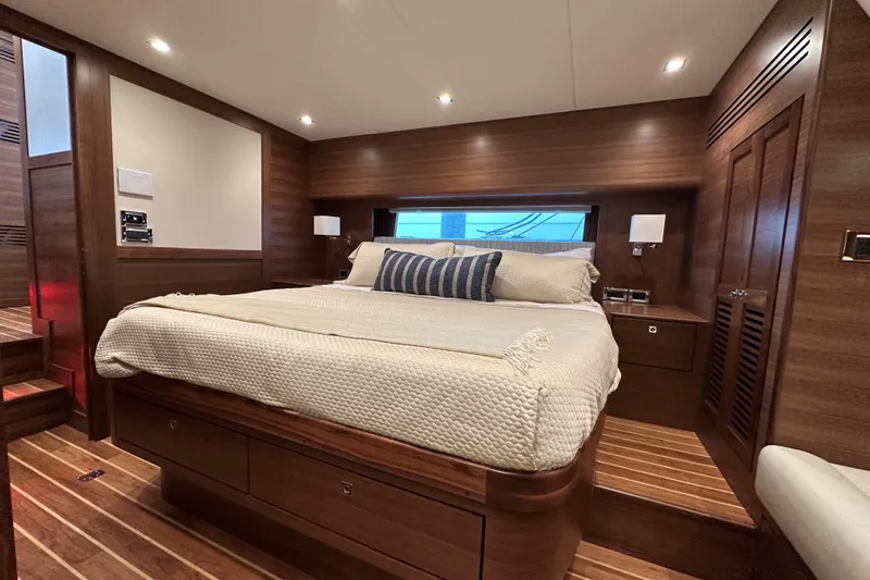 Slide: The Image of Luxurious cabin interior of 2026 Summit 54 yacht with wooden finishes and cozy bedding. - 17