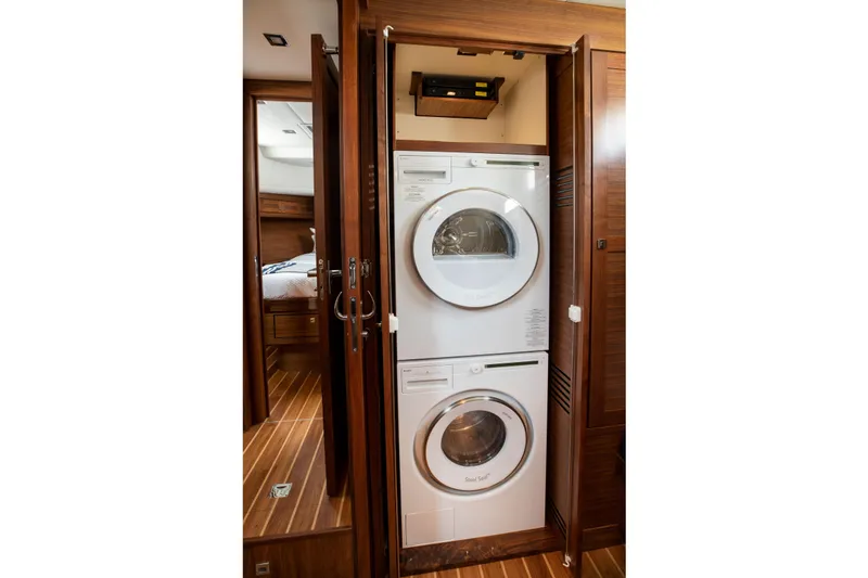 Slide: The Image of Luxurious bathroom in 2026 Summit 54 yacht with modern fixtures and wood accents. - 24
