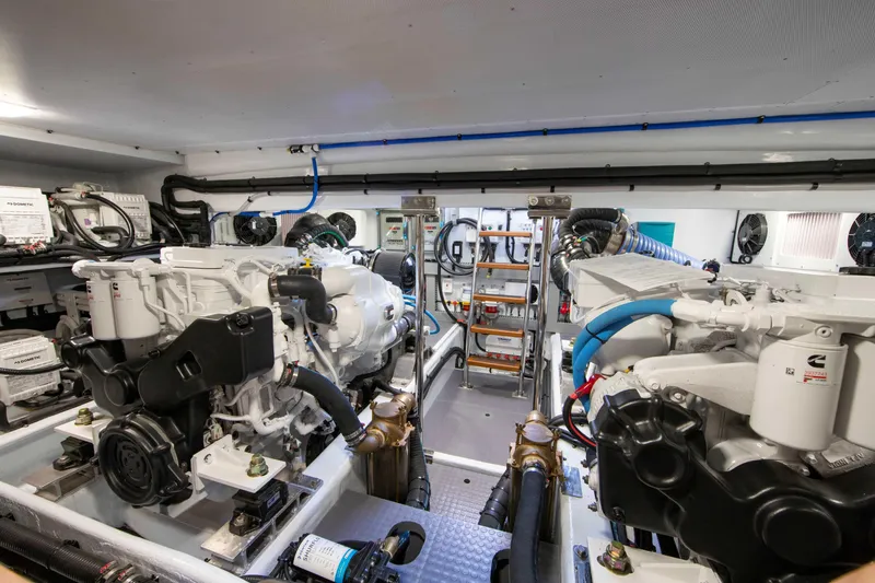 Slide: The Image of Luxurious Summit 54 yacht deck with striped seating, helm chairs, and marina view, 2026 model. - 27