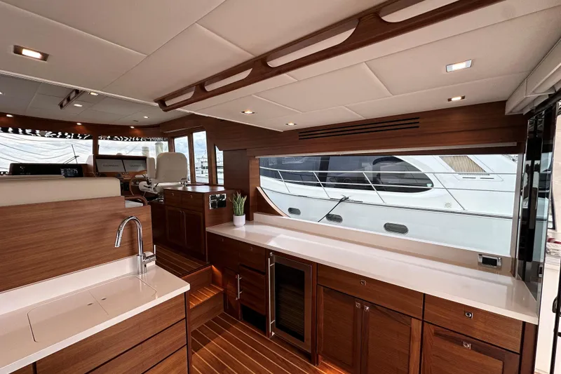 Slide: The Image of Luxurious interior of 2026 Summit 54 yacht with modern wood finishes and sleek design. - 7