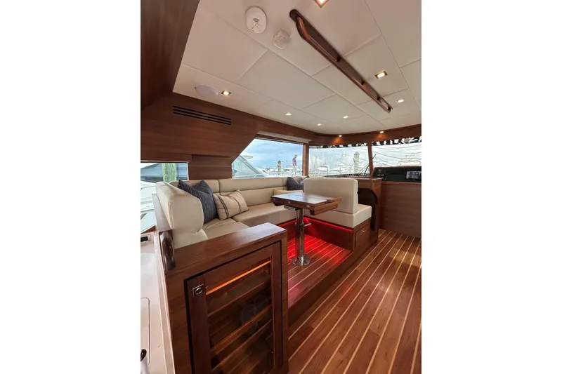 Slide: The Image of Luxurious interior of 2026 Summit 54 yacht with elegant wood finish and plush seating. - 8