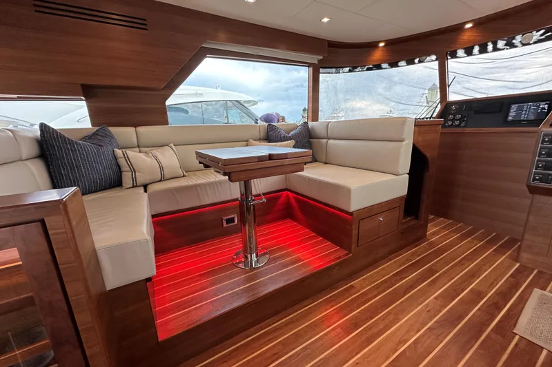 Slide: The Image of Luxurious interior of 2026 Summit 54 yacht with elegant seating and ambient lighting. - 9