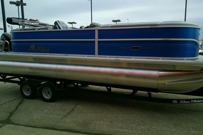 Slide: The Image of 2026 Sun Tracker Party Barge 22 DLX pontoon boat on trailer, side view. - 103