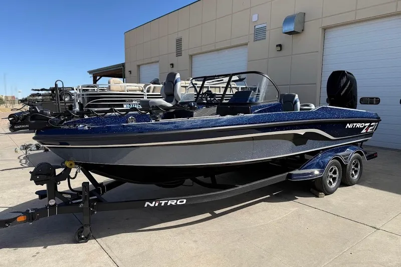 The Image of 2026 Nitro ZV21 Pro boat on trailer, parked outside a building. - 0