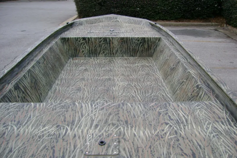 Slide: The Image of 2026 Tracker Grizzly 1648 Utility boat with camouflage interior design. - 5