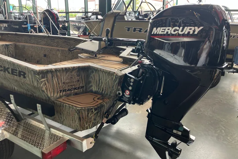 Slide: The Image of 2026 Tracker Grizzly 1650 T Prairie Wings Edition boat with Mercury outboard motor. - 5